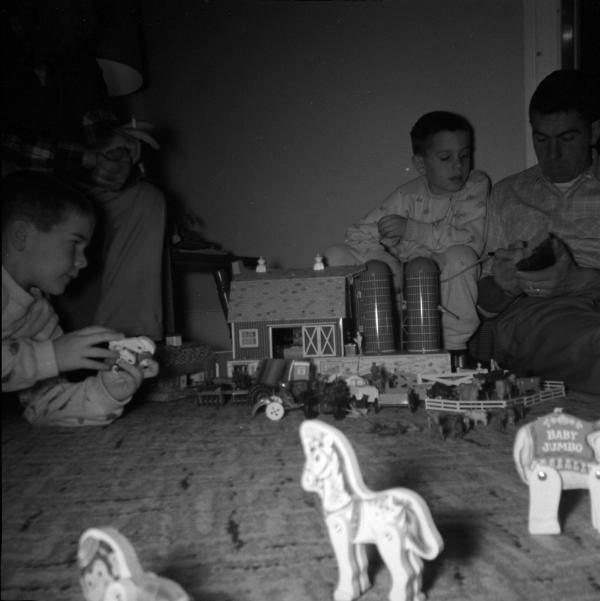 Edward Garretson and boys with a Farm Toy