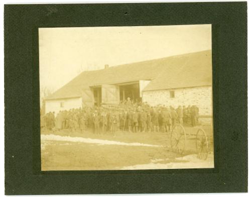 Large group Gathers in Front of a Barn