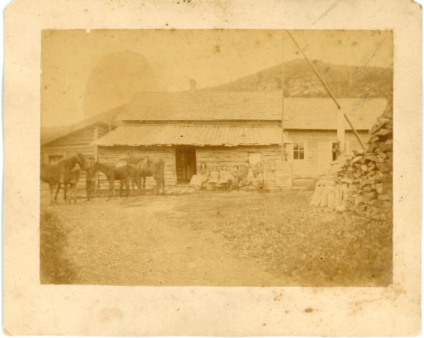 Family Beside their Home