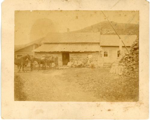 Family Beside their Home