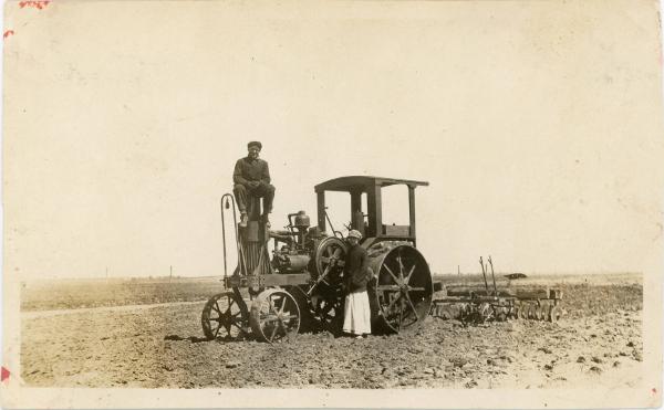 Man & Woman with Steam Powered Tractor and Plow