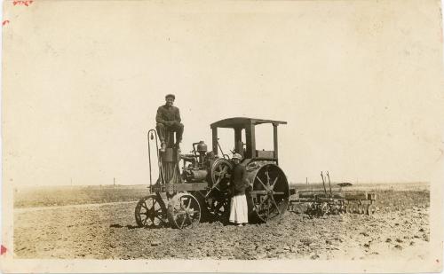 Man & Woman with Steam Powered Tractor and Plow