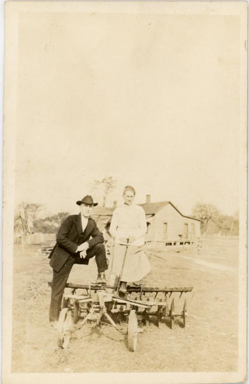Man & Woman Pose with a Disk Harrow