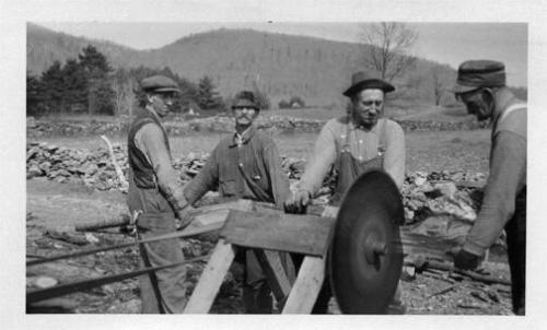 Cutting Wood with a Belt-Driven Saw 
