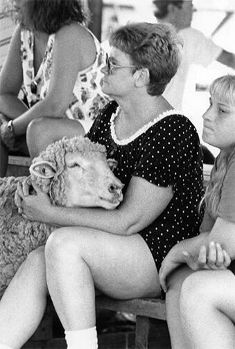 Woman Coddling a Sheep