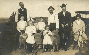 Family Posed with Farm Animals