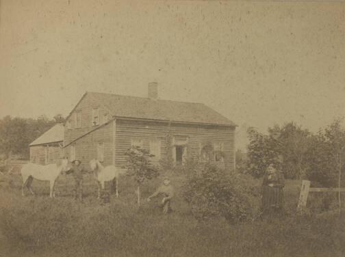 Figures in Front of Homestead
