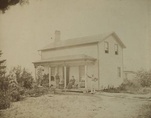 Figures on Porch of House