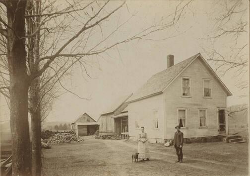 Man and Woman Outside Homestead