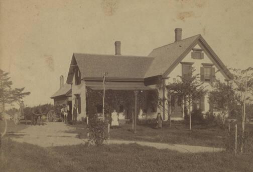 Family in Front of House
