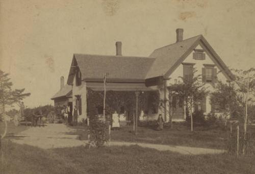 Family in Front of House