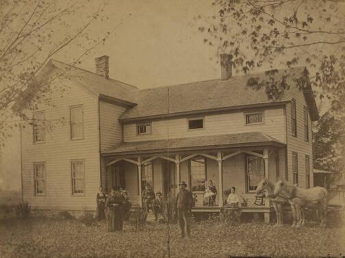 Family On Porch Outside of House