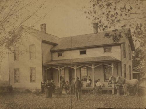 Family On Porch Outside of House