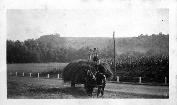 Three Children on a Hay Wagon