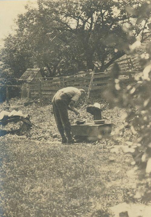 Man Using Outdoor Sink at Duroe-Dell Farm