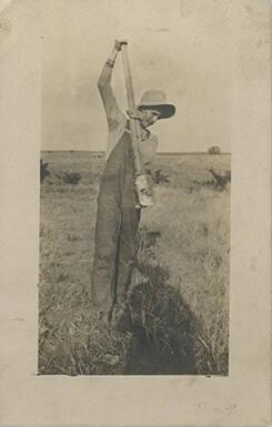 Man with Post Hole Digger