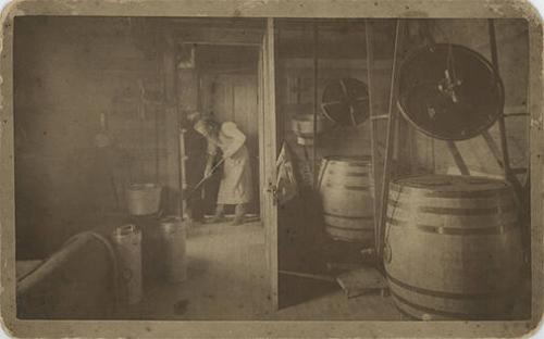 Man Cleaning a Dairy House
