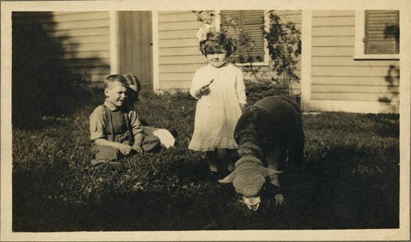 Three Children and a Sheep