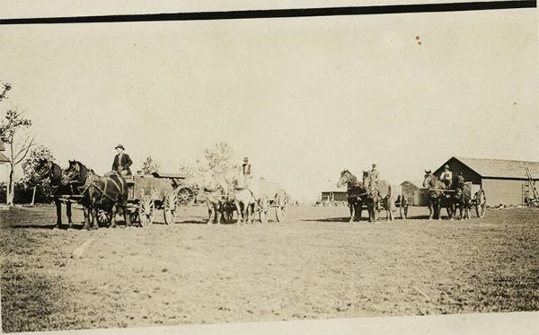 Caravan of Men with Horses and Wagons