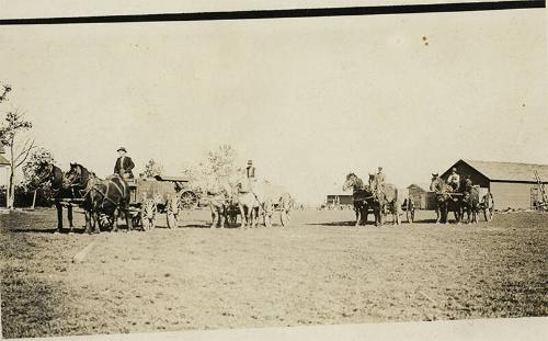 Caravan of Men with Horses and Wagons