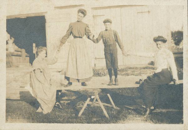 Women and Child on Plank