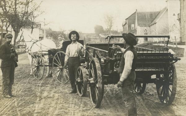 Four People and a Manure Spreader