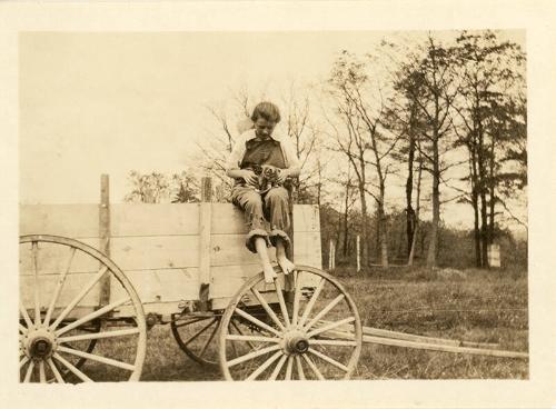 Little Girl on Wagon with Kittens