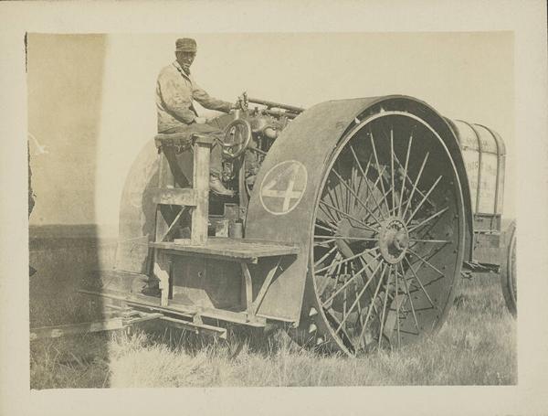 Man Seated on Big Four Tractor