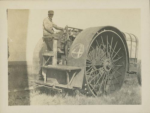 Man Seated on Big Four Tractor