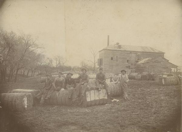 Group of Men on Bales of Cotton