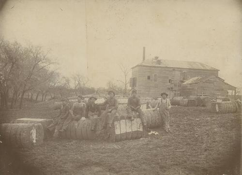 Group of Men on Bales of Cotton