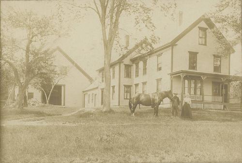 Couple with Horse in Front of Farmhouse
