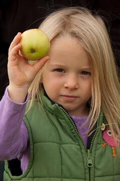 Girl with Apple at Middlefield Orchard