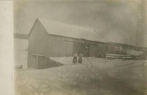 Two Women in Front of Snowy Barn