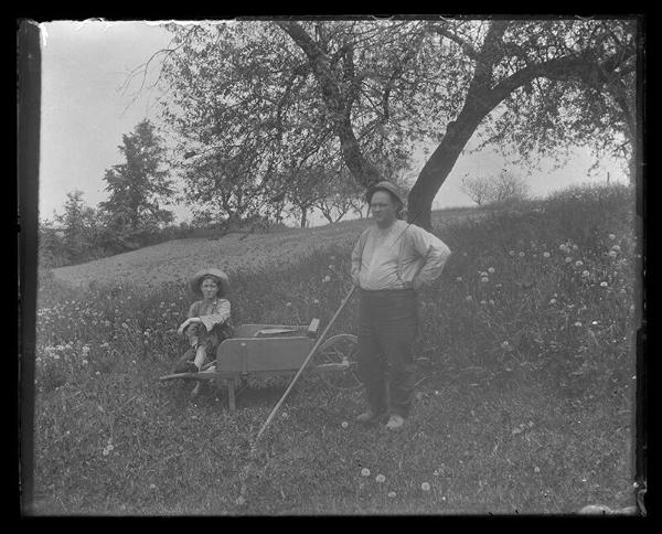 Boy Seated on a Wheelbarrow