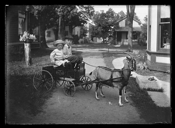 A Boy and Girl on a Miniature Cart