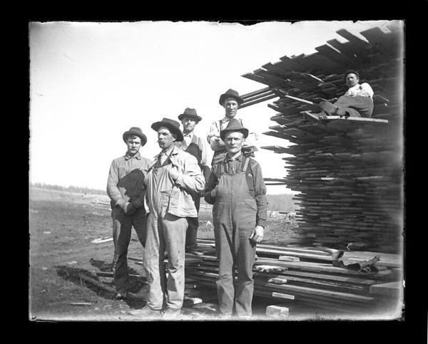 Six Men and a Lumber Stack
