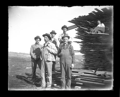 Six Men and a Lumber Stack