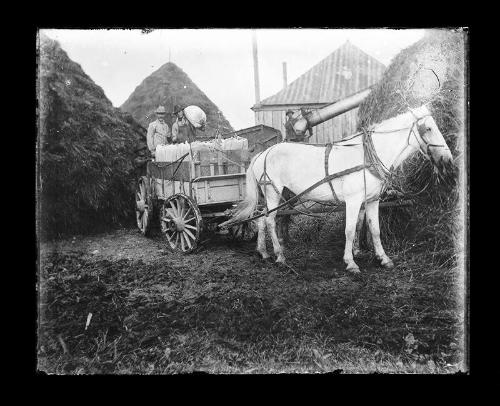 Three Men Loading a Wagon