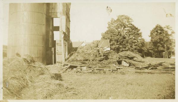 Loose Hay in Yard With Large Silo