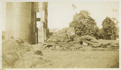 Loose Hay in Yard With Large Silo