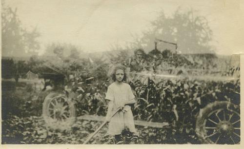Double Exposure of Girl In Front of Corn and Man Sitting In Car Behind