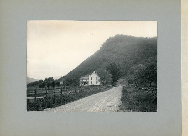 Farmhouse at the Bottom of a Hill