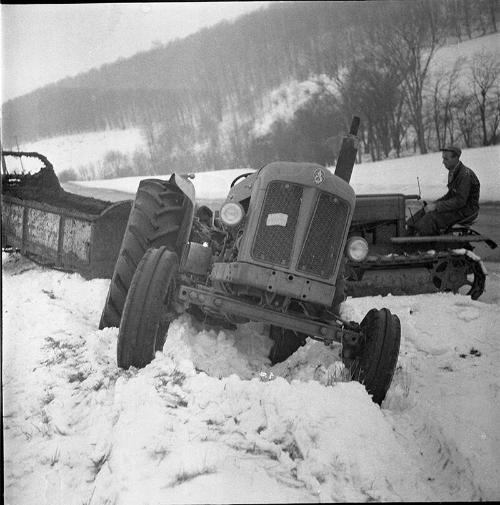Tractor and Spreader Stuck in the Snow