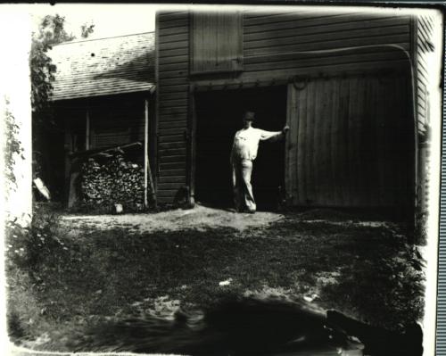 Man in Barn Doorway