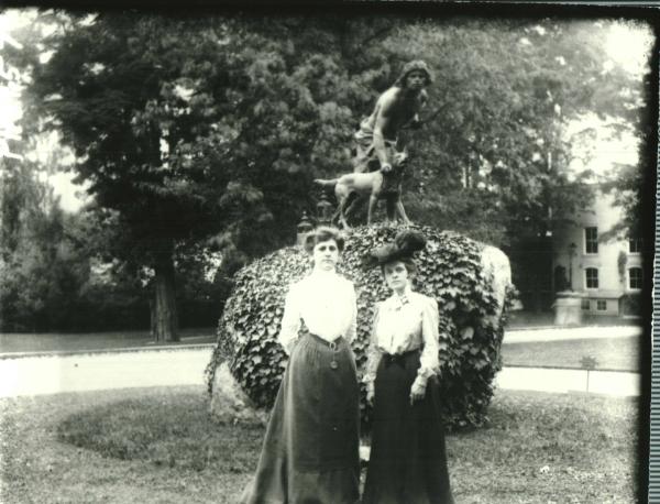 Two Women in Front of Hunter & Dog Statue