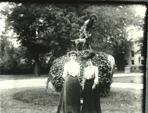 Two Women in Front of Hunter & Dog Statue